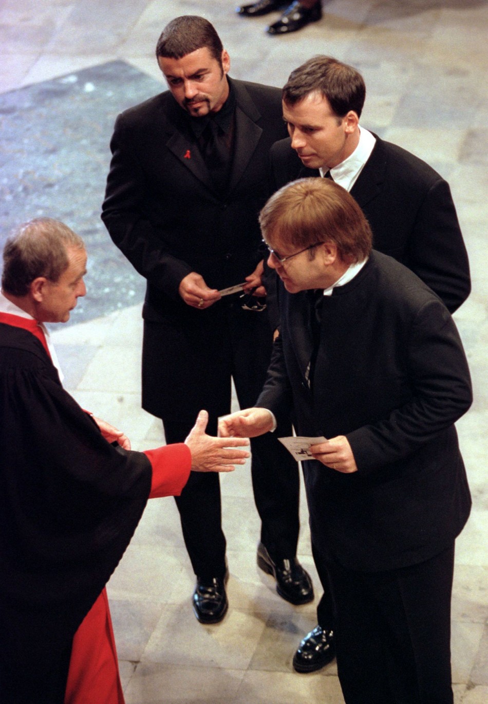 Michael top, Elton John R and David Furnish C at the funeral service for Diana, Princess of Wales at Westminster Abbey, September 6,1997