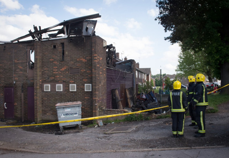 Firefighters stand at the firefighter walks past the Al-Rahma Islamic Centre in Muswell Hill (Reuters)