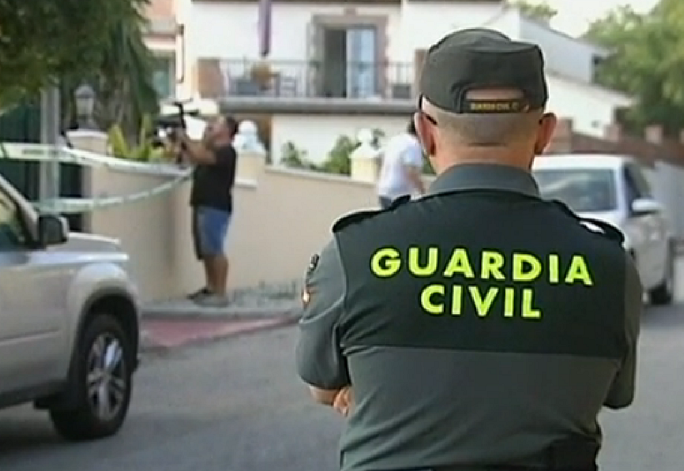 Police guard property at which three three people were found dead