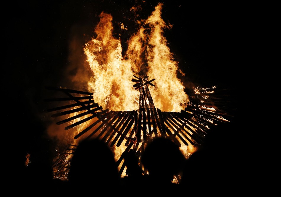 A wooden phoenix burns on the first day of the Glastonbury music festival at Worthy Farm in Somerset June 26, 2013.