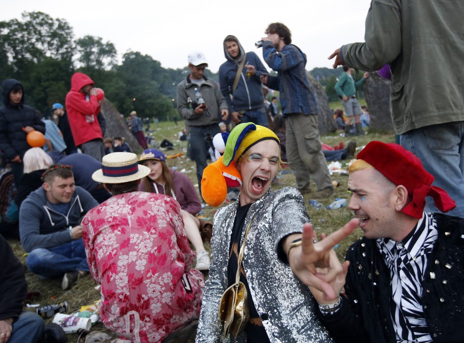 Festival-goers wait for sunrise at the stone circle