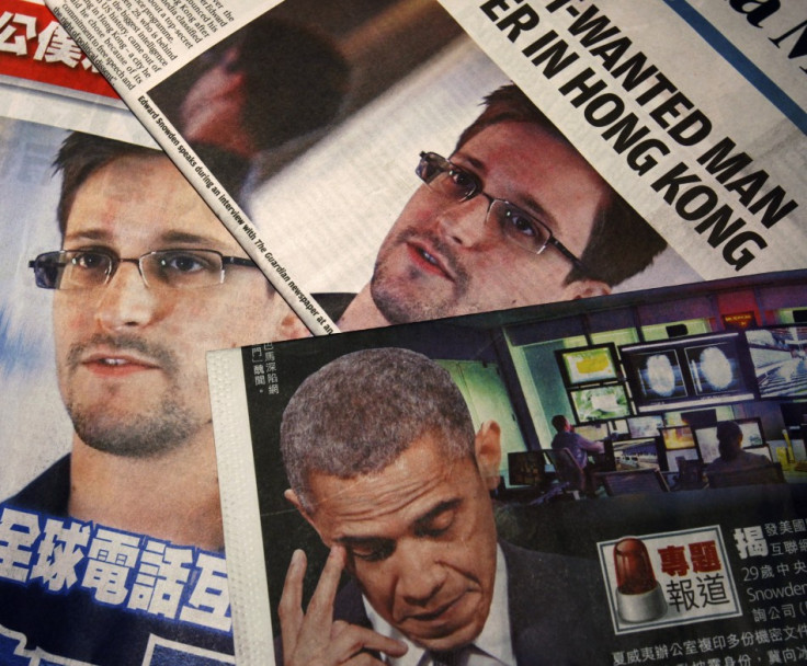 Photos of Edward Snowden, a contractor at the National Security Agency (NSA), and U.S. President Barack Obama are printed on the front pages of local English and Chinese newspapers in Hong Kong