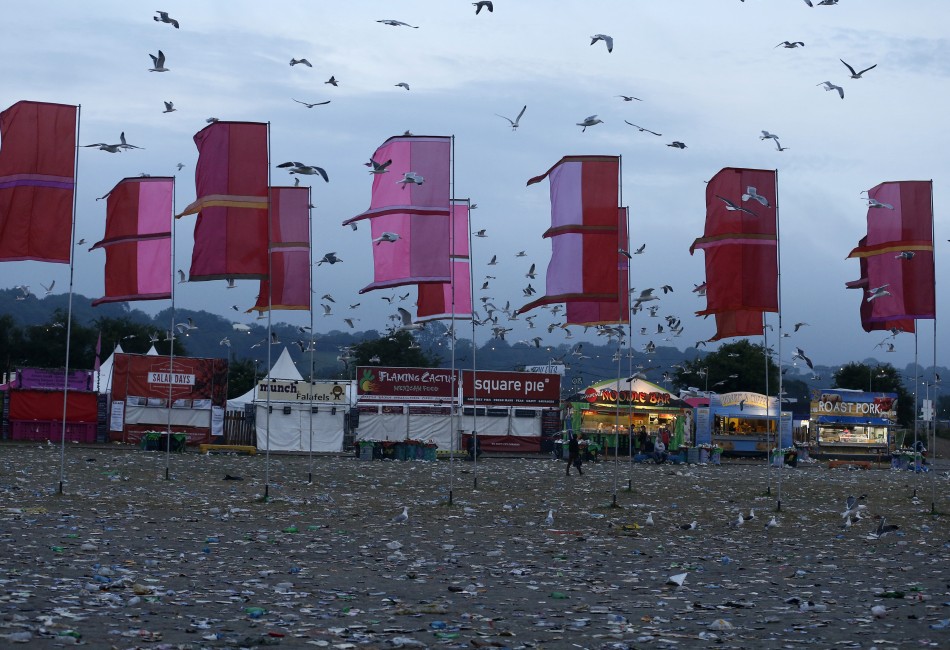 The field in front of the Other Stage is covered in litter at the Glastonbury music festival at Worthy Farm in Somerset, June 29, 2013.