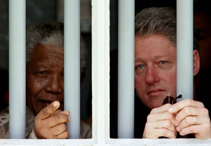 Mandela (l) in Robben Island cell with Bill Clinton