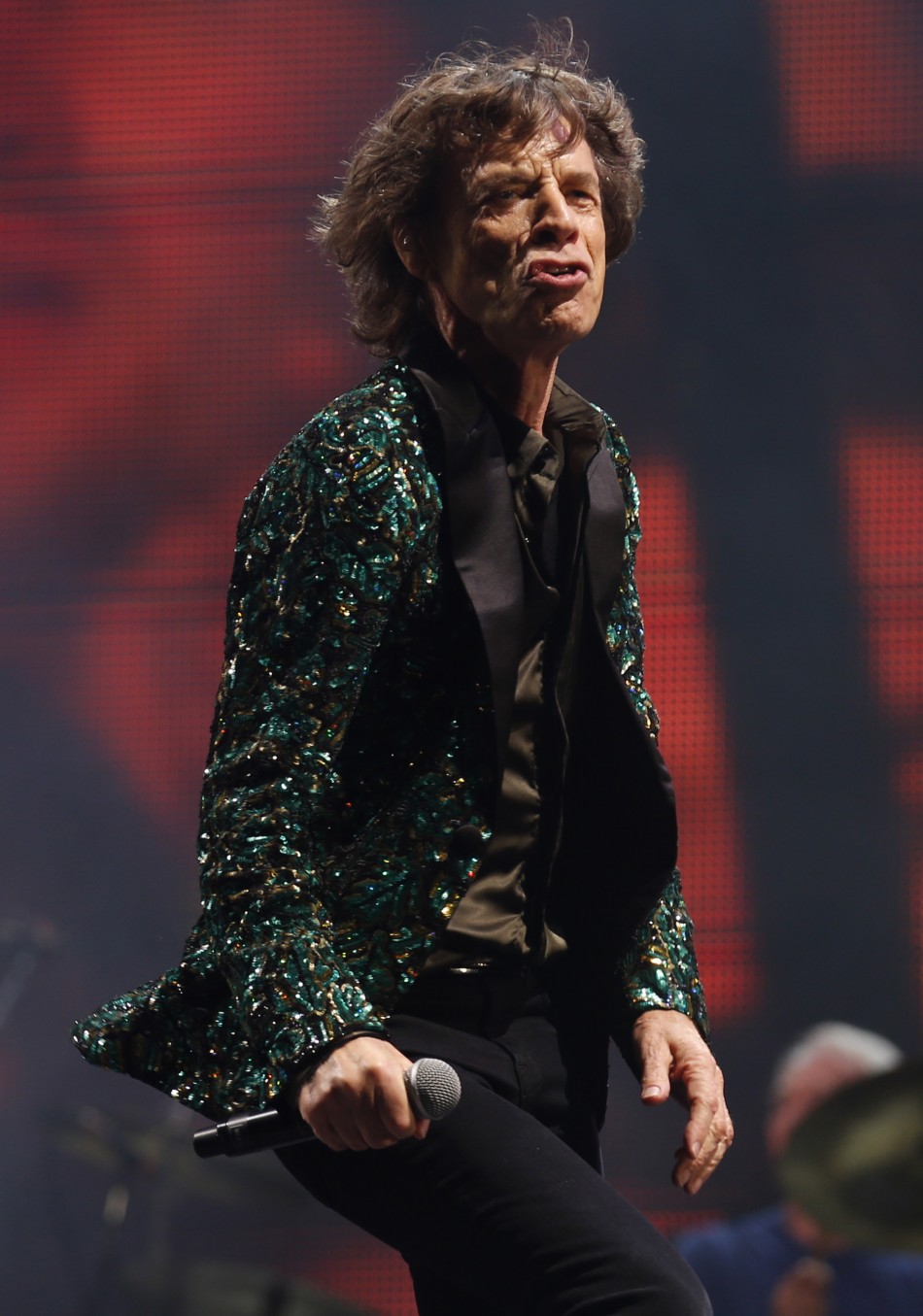 Mick Jagger of the Rolling Stones performs on the Pyramid Stage at Glastonbury music festival at Worthy Farm in Somerset, June 29, 2013.