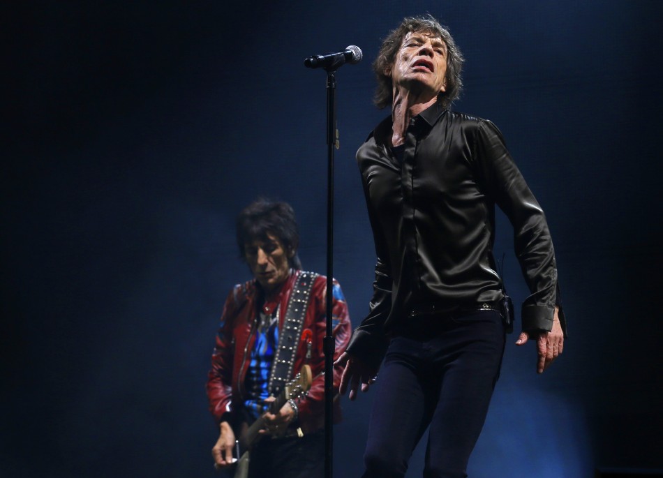 Ronnie Woods and Mick Jagger of the Rolling Stones perform on the Pyramid Stage at Glastonbury music festival at Worthy Farm in Somerset, June 29, 2013.