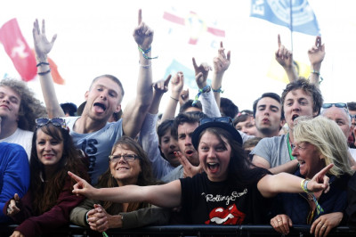 Festival goers watch Primal Scream perform on the Pyramid Stage at Glastonbury music festival at Worthy Farm in Somerset, June 29, 2013.