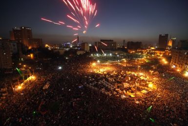 Protesters opposing Egyptian president Mohamed Morsi set off fireworks in Tahrir Square (Reuters)