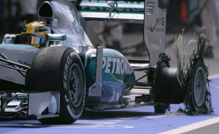 Mercedes'r Lewis Hamilton enters the pit after suffering a blow-out at the British Grand Prix at Silverstone (Reuters)