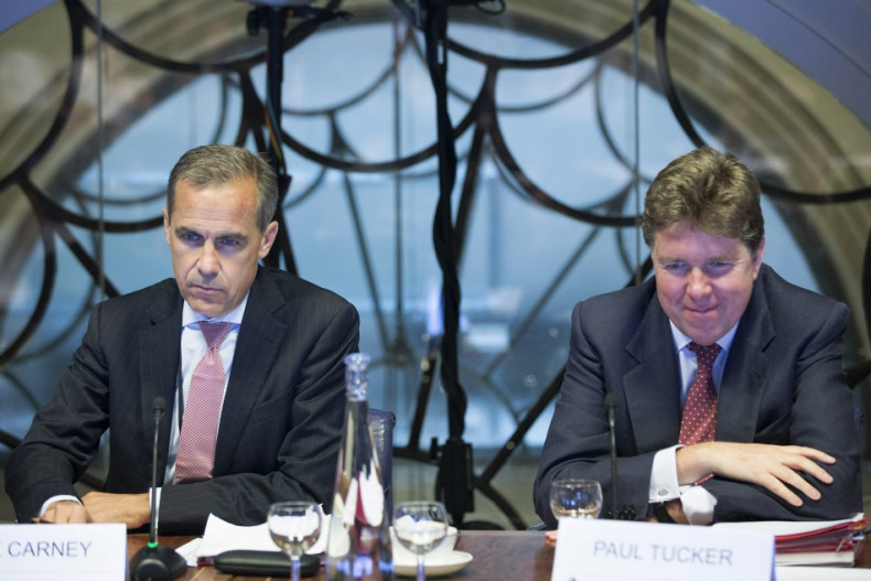 Mark Carney (L), the governor of the Bank of England, and Paul Tucker, outgoing deputy governor at the Bank of England listen, during a monetary policy committee (MPC) briefing on Carney's first day at the central bank's headquarters in London July 1, 201
