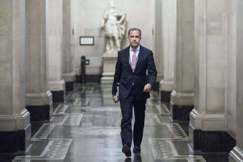 Mark Carney, the governor of the Bank of England, walks to a monetary policy committee (MPC) briefing on his first day inside the central bank's headquarters in London July 1, 2013. (Photo: REUTERS)
