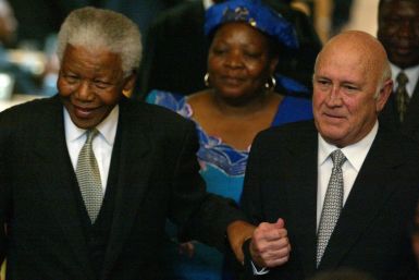 Former South African Presidents Nelson Mandela and FW de Klerk pictured celebrating 10 years of democratic rule (Reuters)