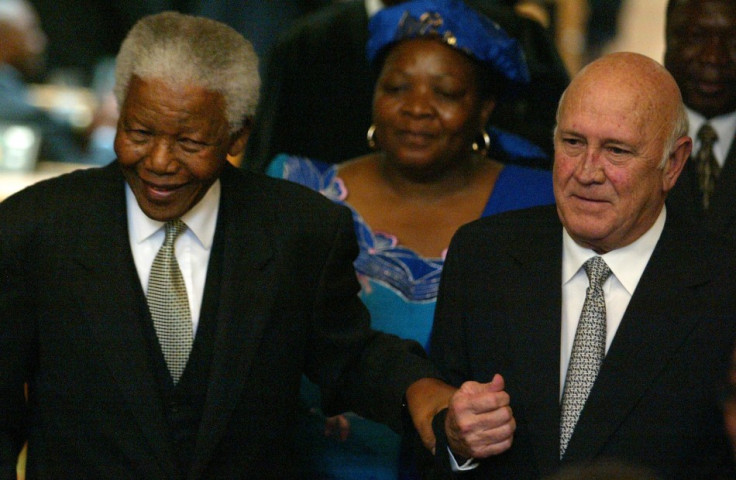 Former South African Presidents Nelson Mandela and FW de Klerk pictured celebrating 10 years of democratic rule (Reuters)