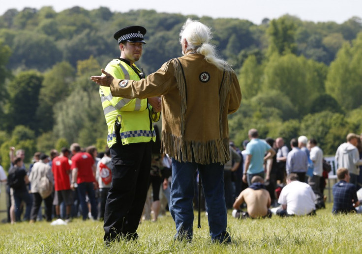 Policeman talks to protester in grounds of Grove Hotel