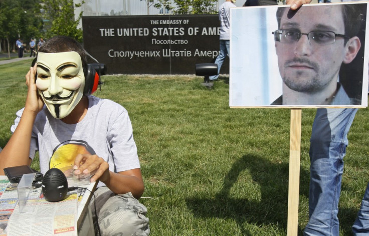 Activists from the Internet Party of Ukraine perform during a rally supporting Edward Snowden, a former contractor at the National Security Agency (NSA), in front of U.S. embassy, in Kiev June 27, 2013. (Photo: Reuters)