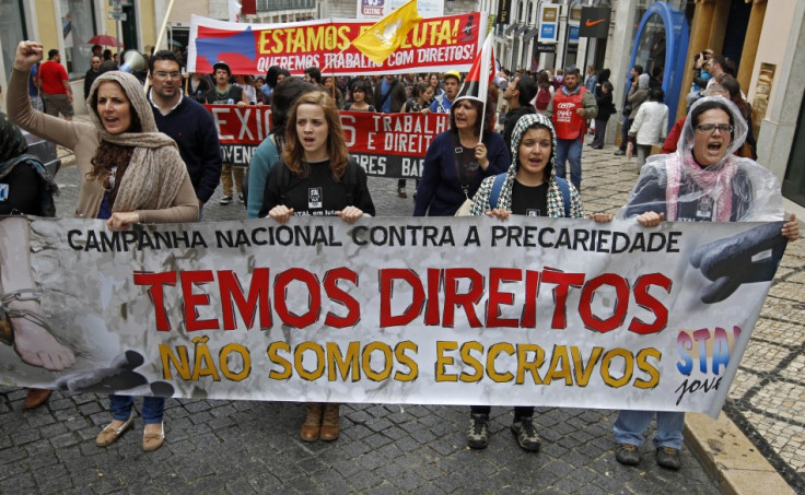 Youth march with a banner saying "We have rights, we are not slaves" during a protest against unemployment in Lisbon  (Photo: REUTERS)