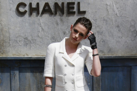 Actress Kristen Stewart poses during a photocall before the Haute Couture Fall Winter 2013/2014 fashion show by German designer Karl Lagerfeld for French fashion house Chanel in Paris July 2, 2013.