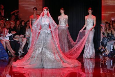 Models present creations by Lebanese designer Elie Saab as part of his Haute Couture Fall Winter 2013/2014 fashion show in Paris