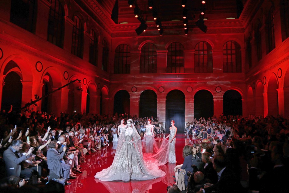 Models present creations by Lebanese designer Elie Saab as part of his Haute Couture Fall Winter 20132014 fashion show in Paris