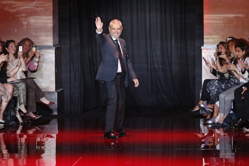 Lebanese designer Elie Saab appears at the end of his Haute Couture Fall Winter 20132014 fashion show
