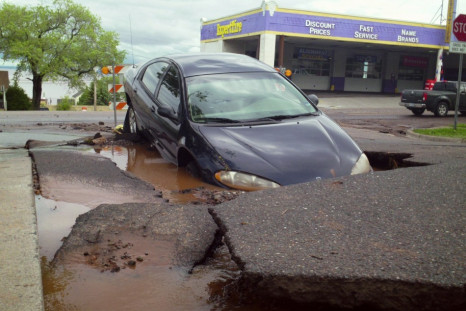 A car trapped in a sink Hole