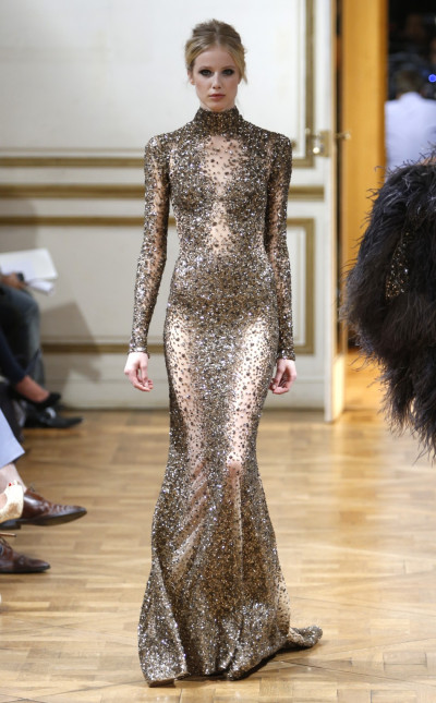 A body-fit silver gown with sequins, semi-precious stones and intricate embroidery