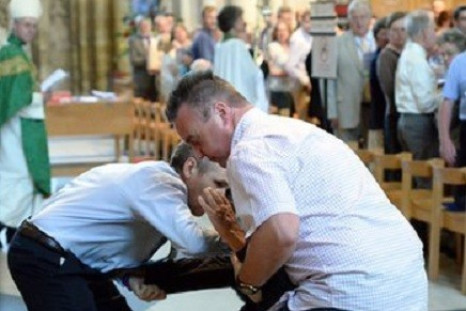 A man is arrested at a General Synod service at York Minster on 7 July