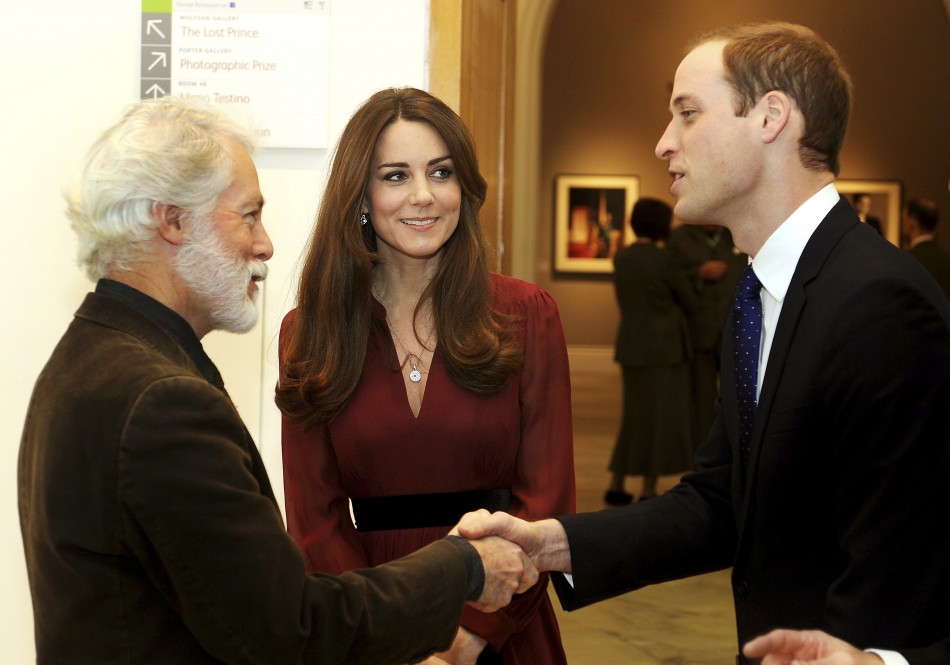Glasgow-born artist Paul Emsley L greets Prince William R during a private viewing of his new official commissioned painting of Catherine, Duchess of Cambridge at the National Portrait Gallery in London January 11, 2013.