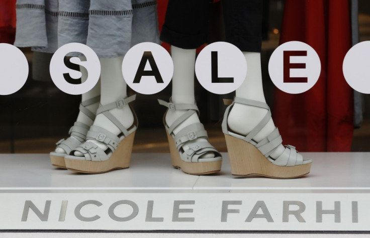 A sale sign is displayed in the window of fashion chain Nicole Farhi in central London