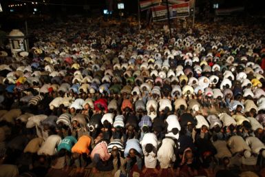 Supporters of deposed Egyptian President Mohamed Mursi perform dawn prayers at the Rabaa Adawiya square
