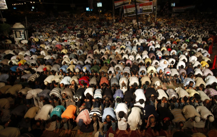 Supporters of deposed Egyptian President Mohamed Mursi perform dawn prayers at the Rabaa Adawiya square