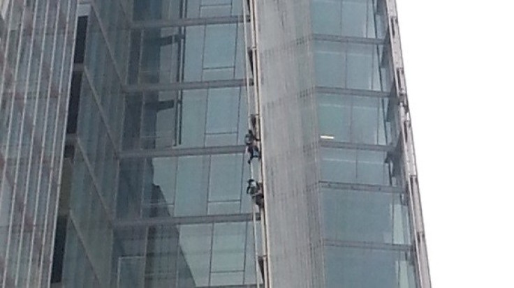 Two of the protesters attempting to climb the Shard (Ewan Palmer/IBTimes)