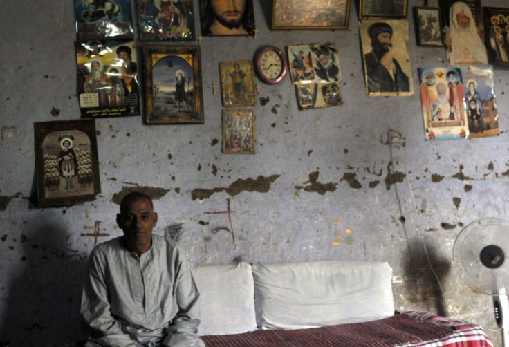 Abied Abdel-Nour, father of Dimiana, a Christian schoolteacher, is pictured in his home in Luxor,