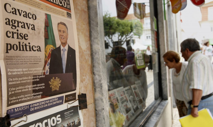 The headlines of the newspaper on the wall reads, "Cavaco deepens political crisis". (Photo: REUTERS)
