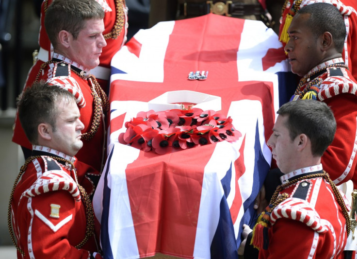 The coffin of Fusilier Lee Rigby is carried by members of his regiment after his funeral service at the parish church in Bury,