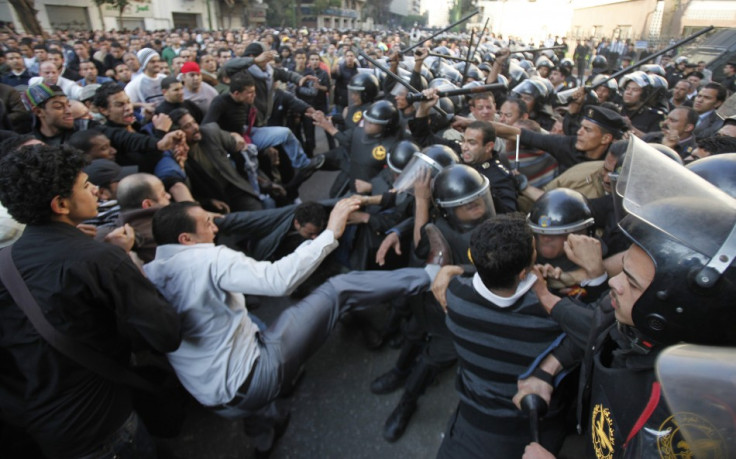 Anti-government protesters clash with police in downtown Cairo (Reuters)