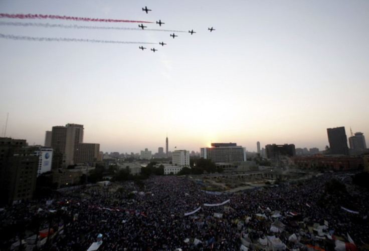 Egyptian military jets fly over Tahrir square full of anti-Morsi supporters (Reuters)