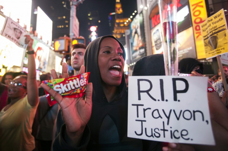 Protester Keisha Martin-Hall holds a bag of Skittles as she participates in a rally in response to the acquittal of George Zimmerman in the Trayvon Martin trial in Times Square