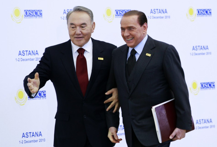 Kazakhstan's President Nursultan Nazarbayev welcomes Italy's Prime Minister Silvio Berlusconi (R)