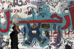 A wall filled with graffiti depicting deposed Egyptian President Mohamed Mursi with a message reading "Leave", at Tahrir Square in Cairo (Photo: Reuters)