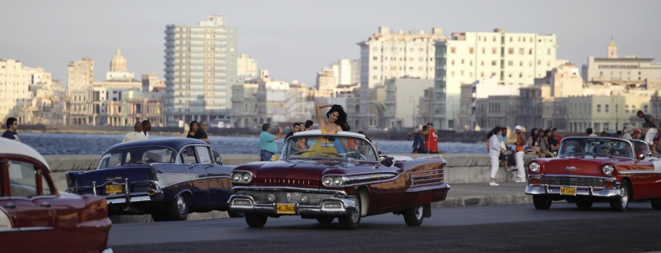 Bollywood star Salman Khan centre R drives with Katrina Kaif in a convertible car on Havanas seafront boulevard El Malecon February 15, 2012.