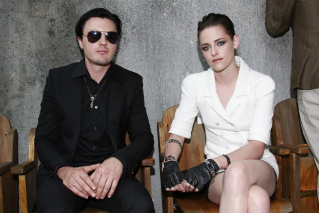 Kristen Stewart (R) and actor Michael Pitt pose before the Haute Couture Fall Winter 2013/2014 fashion show by German designer Karl Lagerfeld for French fashion house Chanel in Paris July 2, 2013.