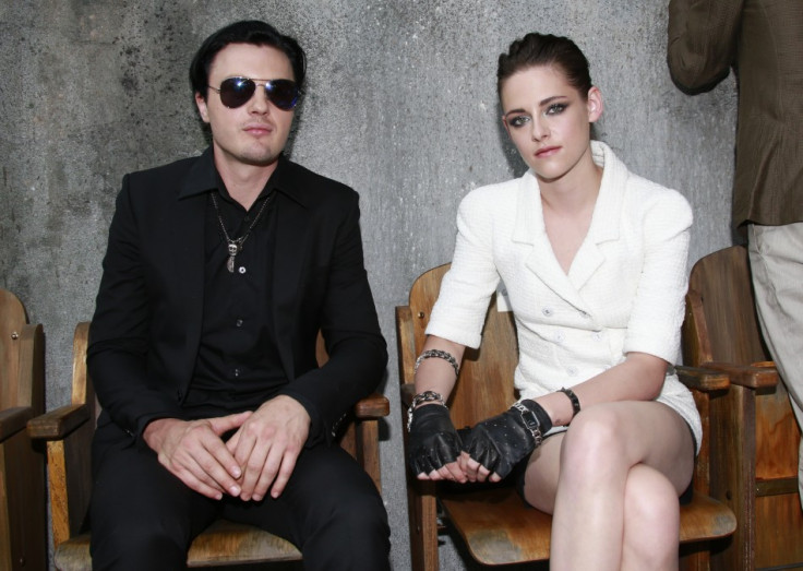 Kristen Stewart (R) and actor Michael Pitt pose before the Haute Couture Fall Winter 2013/2014 fashion show by German designer Karl Lagerfeld for French fashion house Chanel in Paris July 2, 2013.