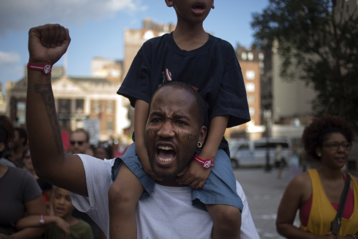 Father and son protest Robert Zimmerman innocent verdict