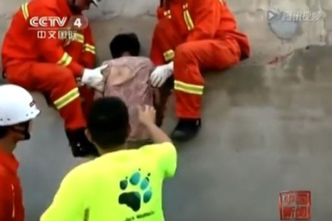 Firefighters rescue Chinese woman stuck between walls