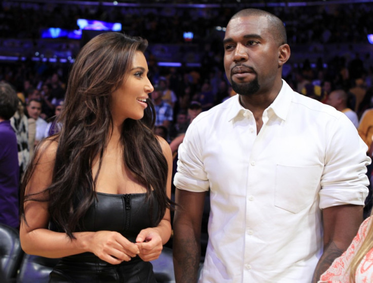 Kim Kardashian (L) and Kanye West `