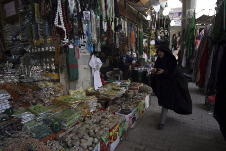 An Iranian woman shops at a market in Baghdad