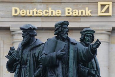 A statue is pictured in front of the former head quarters of Germany's largest business bank, Deutsche Bank in Frankfurt, January 28, 2013.