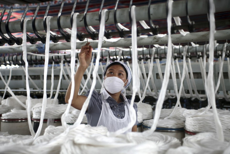 An employee works at a garment factory in China