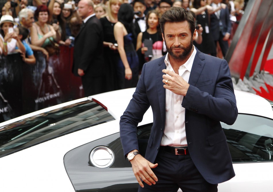 Actor Hugh Jackman poses as he arrives at the UK Premiere of The Wolverine at Leicester Square in London